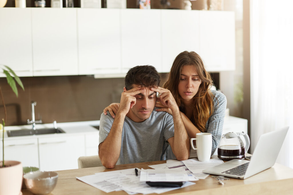 young couple checking their family budget