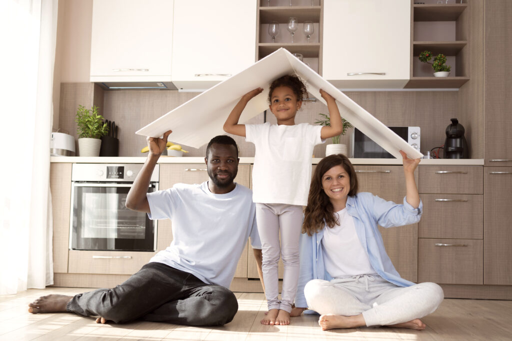 cute family holding roof their head