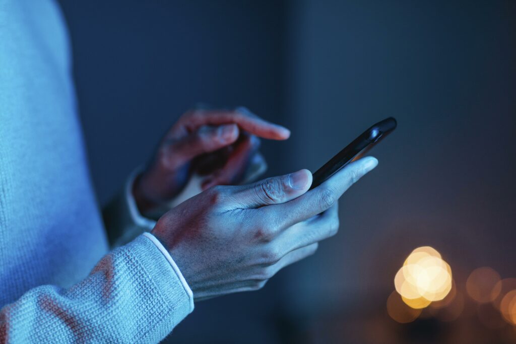 side view man using smartphone 1