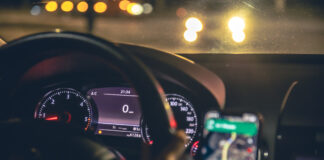 closeup steering wheel navigator car night